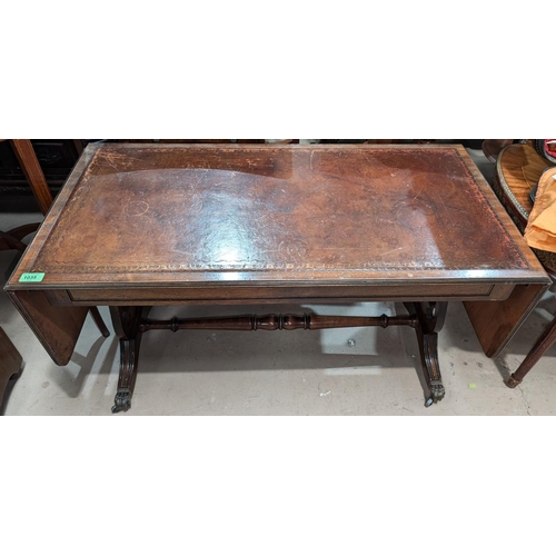 1035 - A reproduction mahogany sofa table with drop ends and a similar nest of tables.No bids sold with nex... 