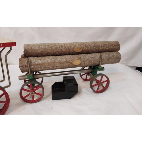 23 - A Mamod Steam powered traction engine and trailer with logs.