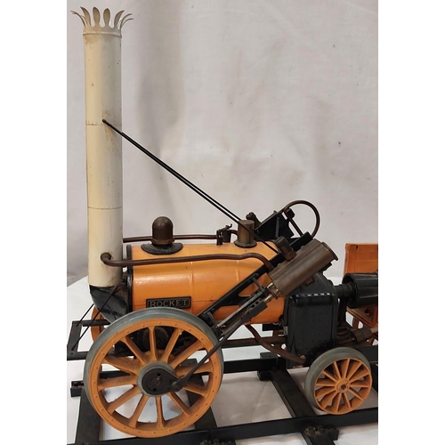 25 - A scale model of Stephenson's ROCKET with carriages.