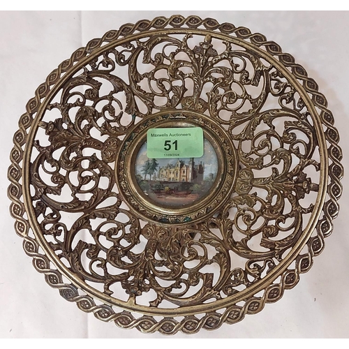 51 - A pierced brass pedestal dish with central miniature.