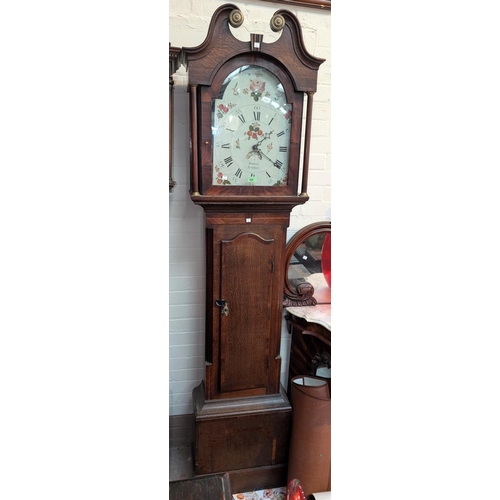 998 - An early 19th Century oak longcase clock with mahogany cross banding, the hood, with swan neck pedim... 