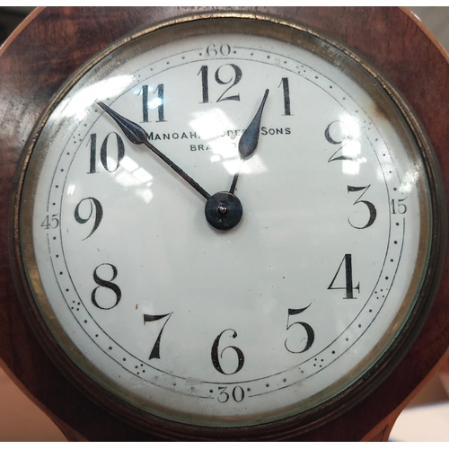 158 - A Liberty style inlaid metal clock with fruitwood and mother of pearl inlay and enamel dial by Manoa... 