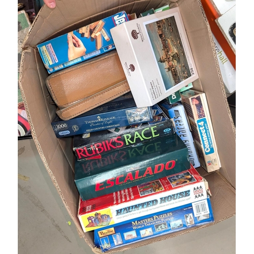 108 - A collection of vintage board games, unopened jigsaw puzzles etc.