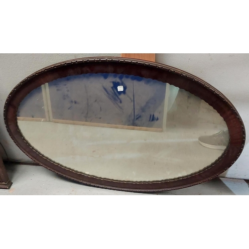 162 - An octagonal art deco wall mirror and another oval shaped 