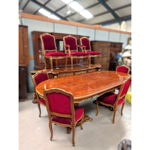 1049 - A Louis XVI style dining table and chairs with burr walnut and inlaid decoration with gilt highlight... 