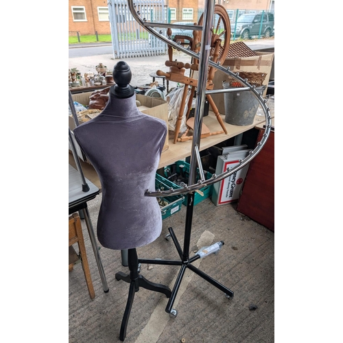 109 - A vintage spiral clothes rack and a dress makers mannequin.No bids sold with next lot