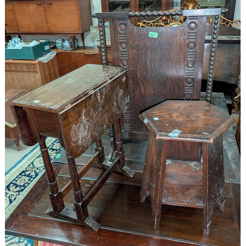 992 - A 1930's oak fire screen, barley twist lamp and three oak tables, an oak drop-leaf table.