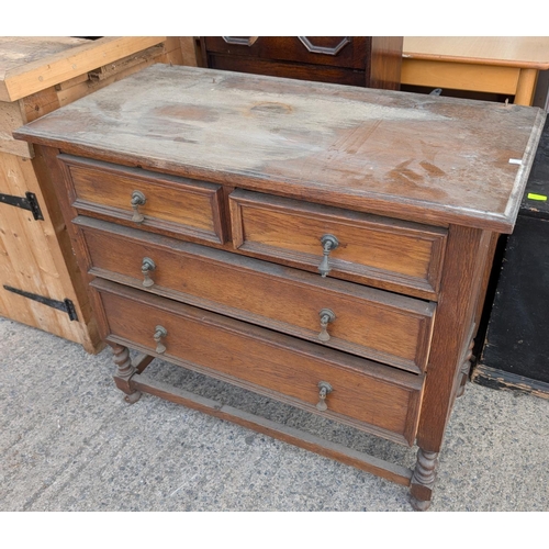 993 - A large oak three-height shelf unit and a wall hanging glass doored cabinet plus an oak chest.