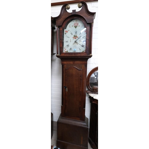 952 - An early 19th Century oak longcase clock with mahogany cross banding, the hood, with swan neck pedim... 