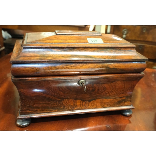 61 - A Georgian Rosewood sarcophagus tea caddy, waisted body, stepped lid, interior glass bowl.