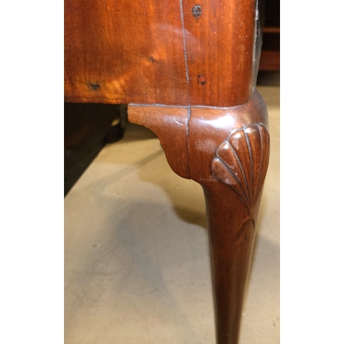 1015 - An Irish 19th century mahogany drop leaf dining table with shell carving to the top of each leg on p... 