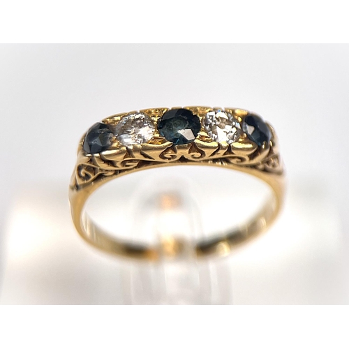 763 - An 18 carat hallmarked gold ring with 3 sapphires and 2 sapphires set alternately, size N/O, 4gm