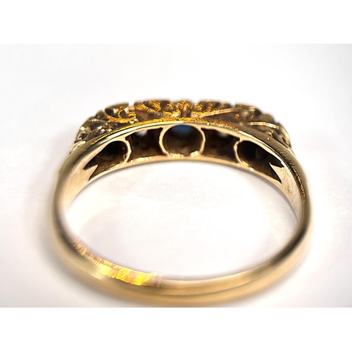 763 - An 18 carat hallmarked gold ring with 3 sapphires and 2 sapphires set alternately, size N/O, 4gm