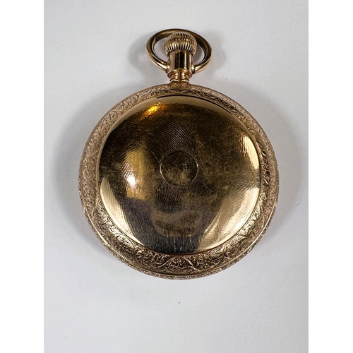 764 - A WATERBURY Duplex gilt cased pocket watch with ornate engraving, early 20th Century.