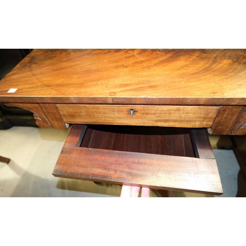 981 - A mahogany Regency style sewing table with velvet bag beneath, u-frame and column base.