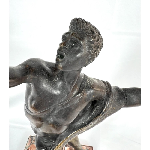 175 - A Grand tour bronze of semi clad man, on later marble base to match original, height 38cm