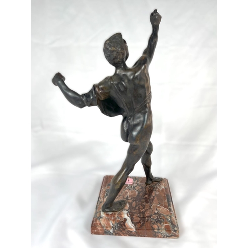 175 - A Grand tour bronze of semi clad man, on later marble base to match original, height 38cm