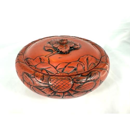 643 - A large 19th Century Chinese cinnabar lacquer covered bowl with leaves in relief, bearing Sainsbury'... 