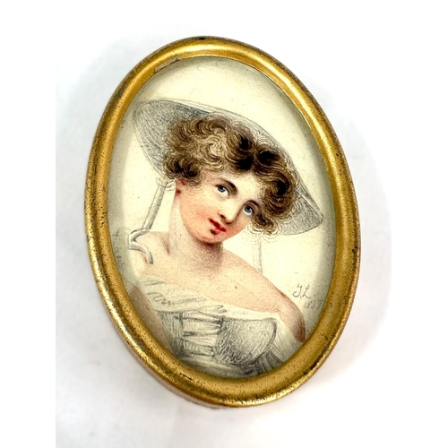 800 - A 19th century miniature portrait of a woman, monogrammed L.T. 1835, 7.5cm