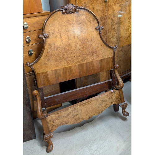 1035 - A burr walnut part bedroom suite featuring a pair of Epstein style single beds foot and irons and a ... 