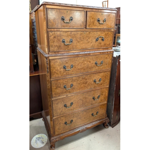 1038 - A tall and impressive set of Burr walnut Epstein style dressing chest with two short and six long dr... 