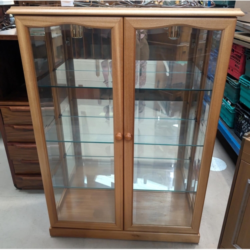 885 - a modern light wood display cabinet, three height.