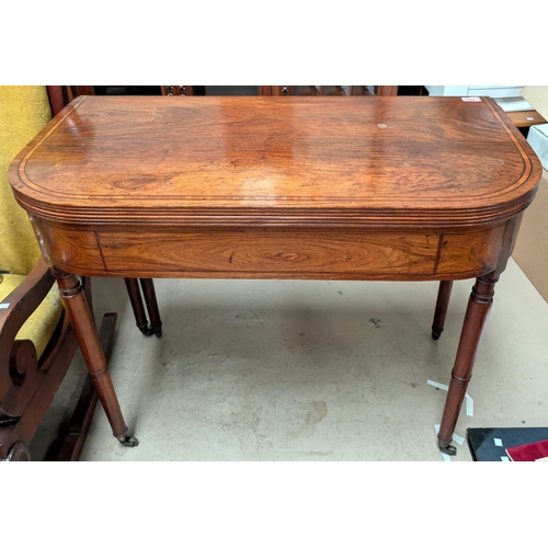 1002 - A Georgian walnut carved table with box wood inlay to the top, secret drawer beneath, turned legs an... 