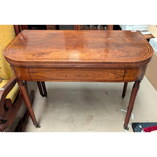 1002 - A Georgian walnut carved table with box wood inlay to the top, secret drawer beneath, turned legs an... 