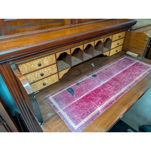 1007 - A Victorian large and impressive mahogany full height bookcase with bevelled glass top with astragal... 