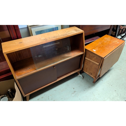 1009 - A mid 20th Century lightwood bookcase of small proportions and an unusual mid 20th Century coffee ta... 