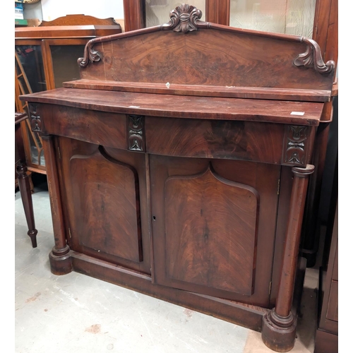 1022 - A 19th century mahogany side cabinet with double panel doors, two drawers, column etc length 122cm