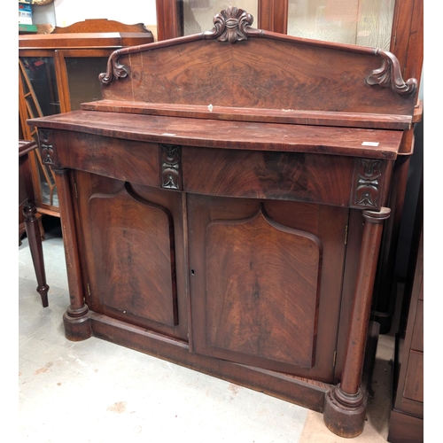 1022 - A 19th century mahogany side cabinet with double panel doors, two drawers, column etc length 122cm