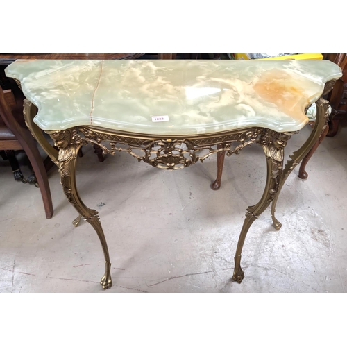 1032 - A gilt metal and onyx console table and similar gilt framed mirror.