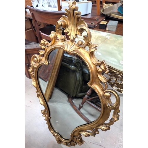 1032 - A gilt metal and onyx console table and similar gilt framed mirror.