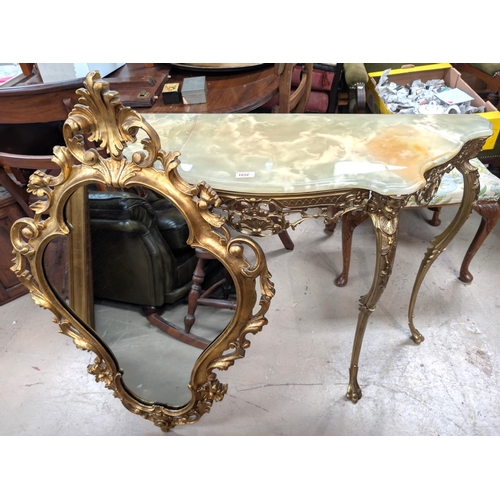 1032 - A gilt metal and onyx console table and similar gilt framed mirror.