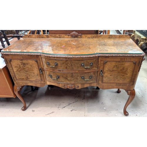 1034 - A good quality Epstein style burr walnut sideboard with two central drawers and two cupboards.