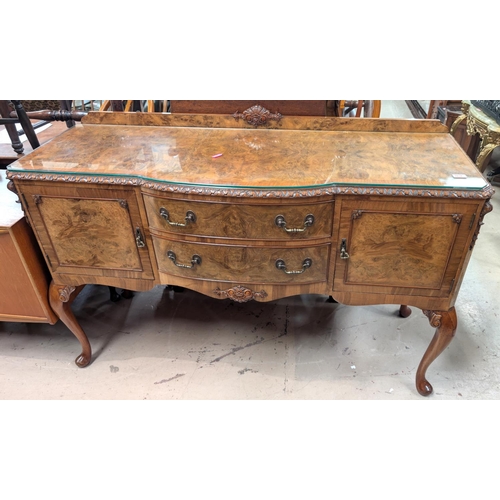 1034 - A good quality Epstein style burr walnut sideboard with two central drawers and two cupboards.