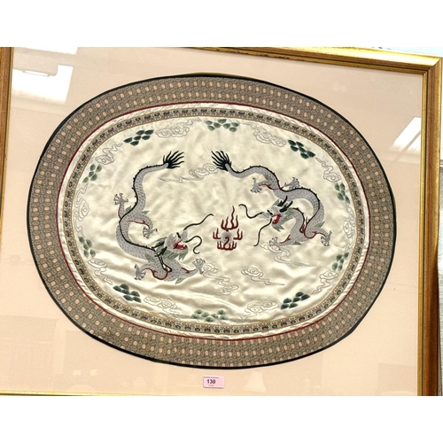 130 - A Chinese silk of two five clawed dragons, framed and glazed.