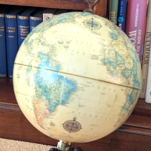 14 - A reproduction library globe and a collection of hardback books, various subjects, Dickens etc.