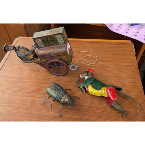 304 - A German tin plate Marke Lehmann wind up beetle, a Marke Lehmann German monkey and tin plate organ g... 