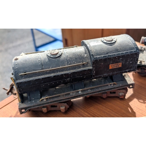 309 - A Brimtoy tin plate boxed train set; an 'O' gauge Lionel Corporation train and another.