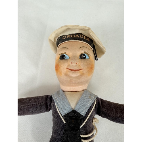 311 - A vintage Norah Wellings cloth sailor doll with Orcades cap band; a vintage 1940's era sailor doll, ... 