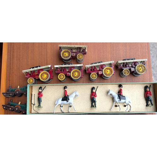 335 - A boxed set of Britain's guards, five Lesney steam traction engines and two trains.