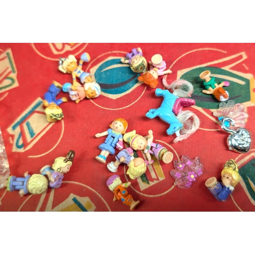 344 - Polly Pocket, a multi-layered Polly Pocket toy, a small clam shell Polly Pocket toy and a selection ... 