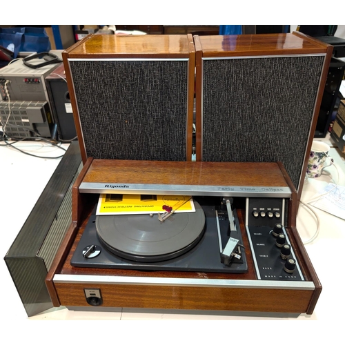 355 - A vintage Rigonda 'Part Time Calypso' record player and speakers; a Neostar record re-recorder.