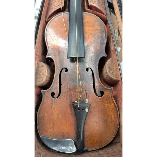 389 - A 19th century violin with case and bow back length 35cm