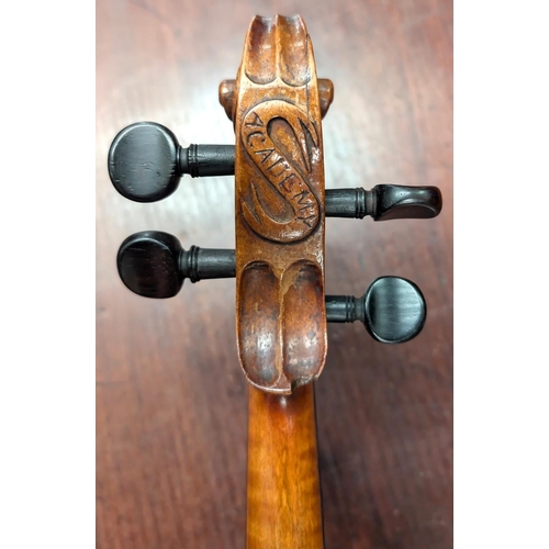 393 - A 19th century violin with spurious label with carved academy detail to back of head, back length 35... 