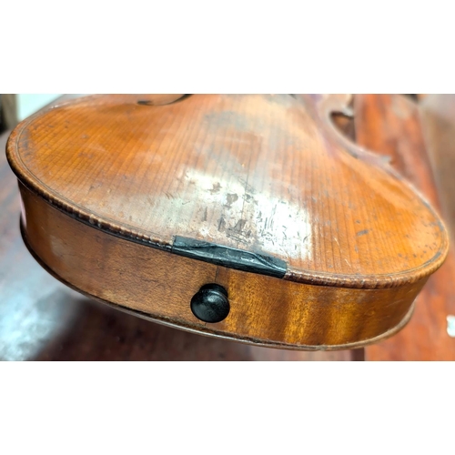 393 - A 19th century violin with spurious label with carved academy detail to back of head, back length 35... 