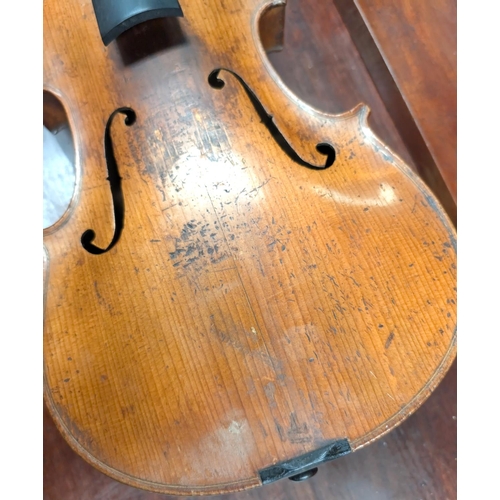 393 - A 19th century violin with spurious label with carved academy detail to back of head, back length 35... 