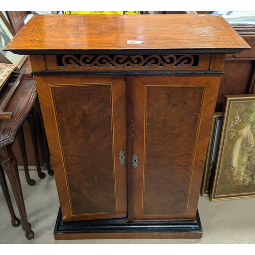 399 - A 'The Britannia' unusual 19th Century upright polyphone disc player in walnut cabinet.